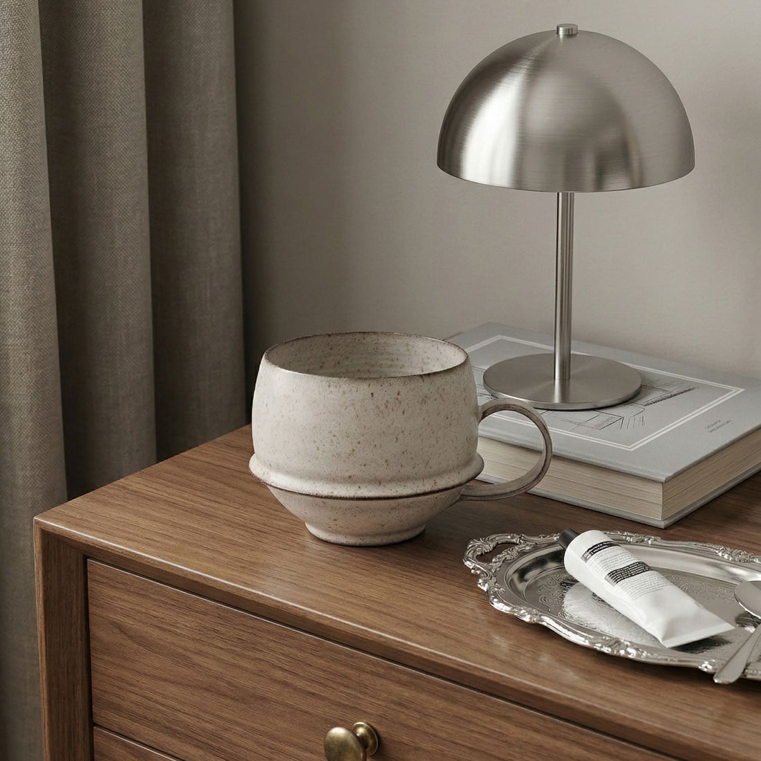 Beige ceramic cup on a light beige background