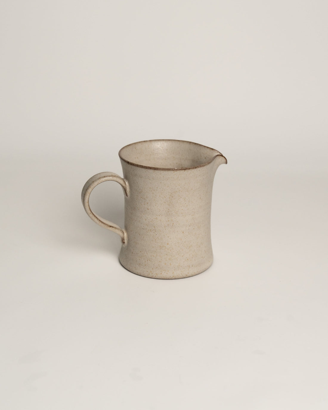 Lunar Sand ceramic creamer pitcher with loop handle and pouring spout