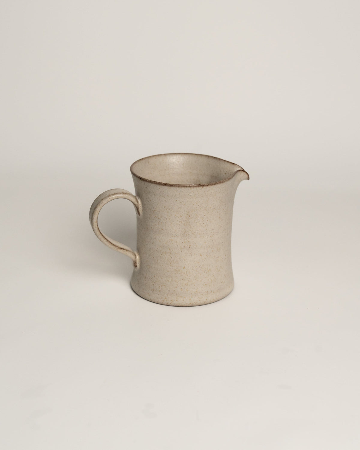 Lunar Sand ceramic creamer pitcher with loop handle and pouring spout