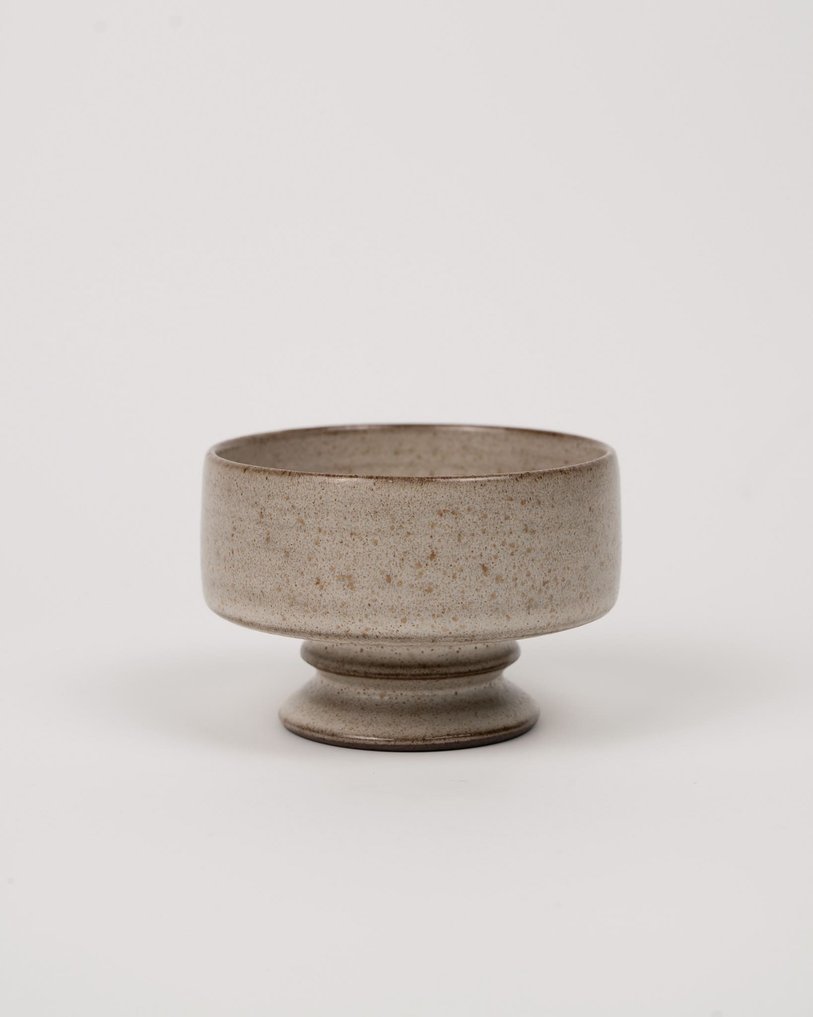Ceramic bowl with a textured surface on a white background